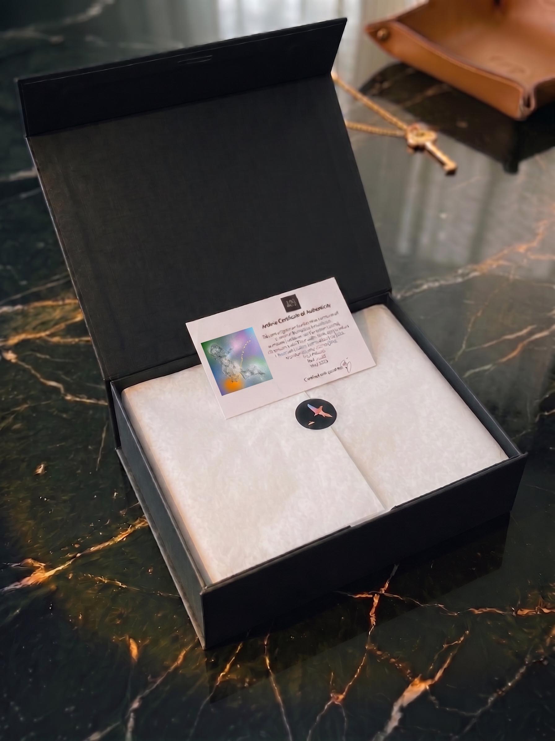 A silk artwork box representing the movement from protected storage to wall display