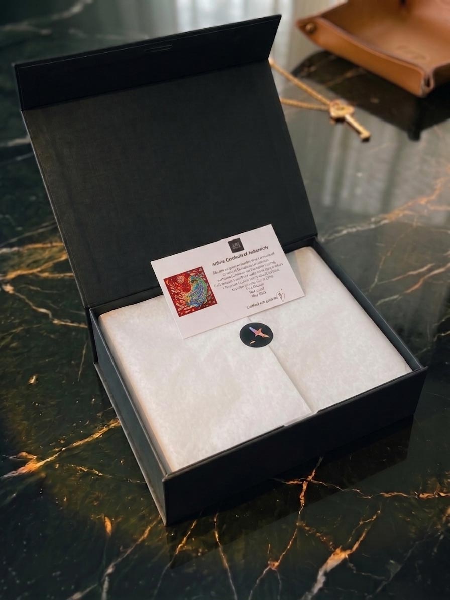 A boxed silk edition representing documented storage between display rotations