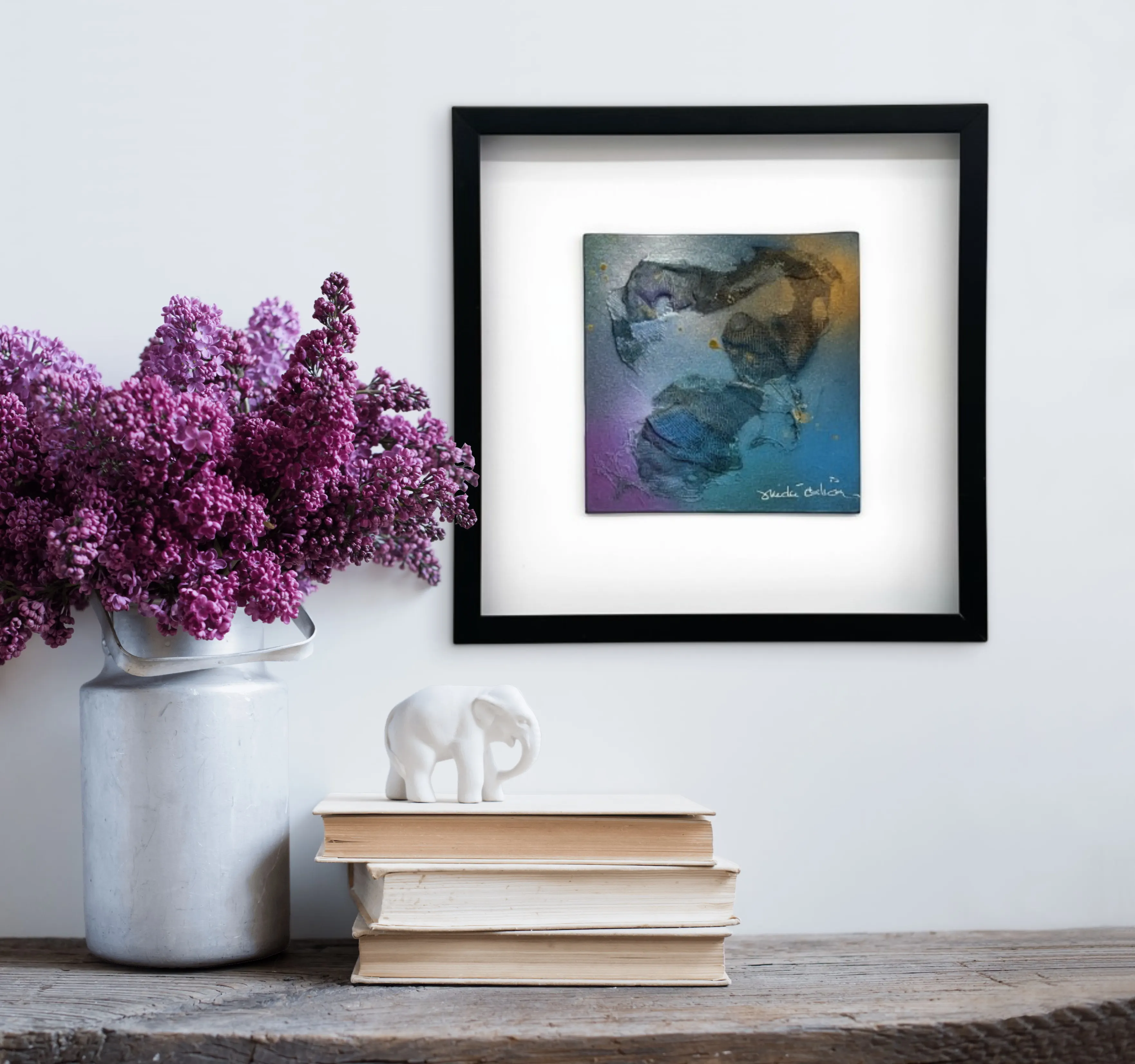 Artwork positioned within the direct sightline of a home workspace